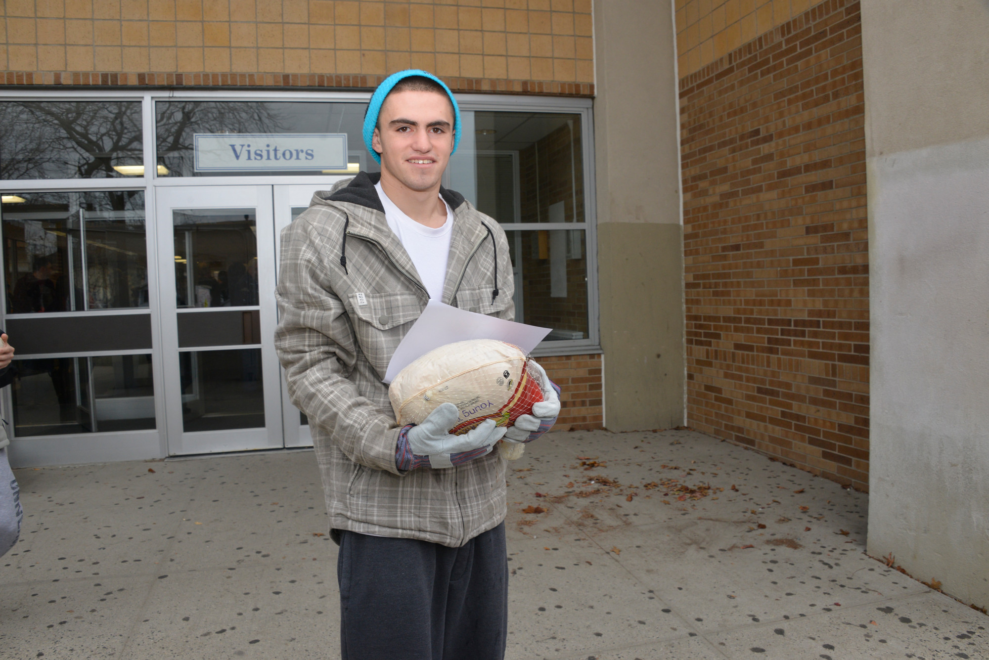 Tim Nolan at the OHS turkey Shoot loads up his car to deliver food to neighbors