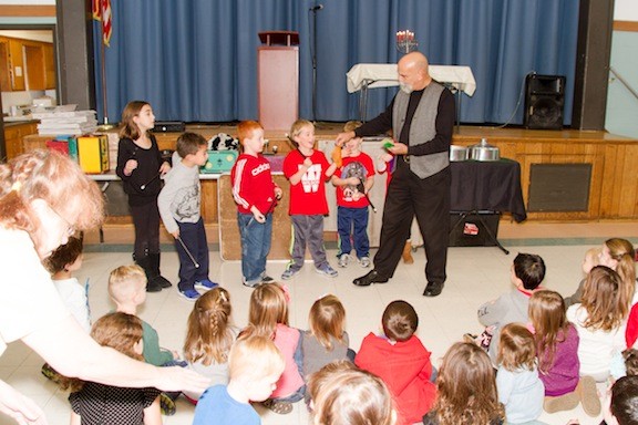 John Turdo of Simply Magic wowed the kids at the celebration with his magic tricks.