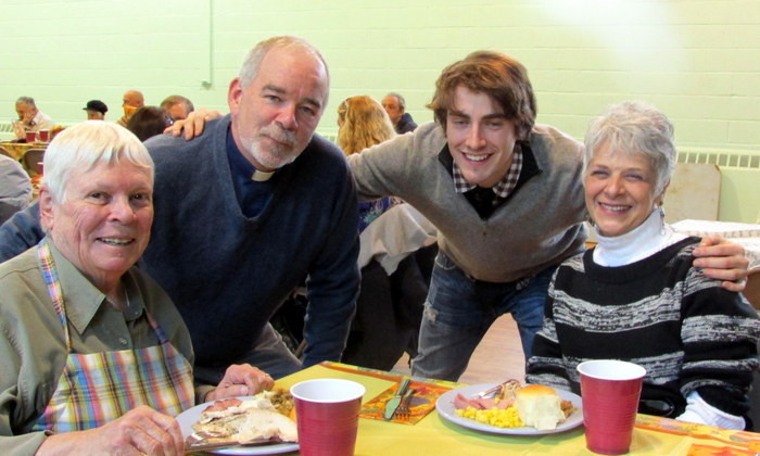 Pastor Mark Lukens and his son, Ben, shared dinner with Jane Philbin, left, and Carol Ann Pagano.