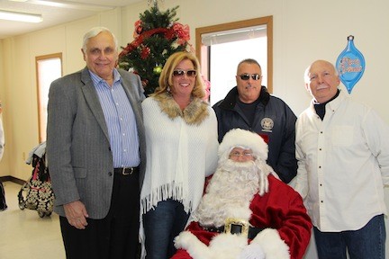 Santa is visited by Island Park’s Village officials, including trustees Henry Hastava and Irene Naudus, as well as Mayor James Ruzicka.