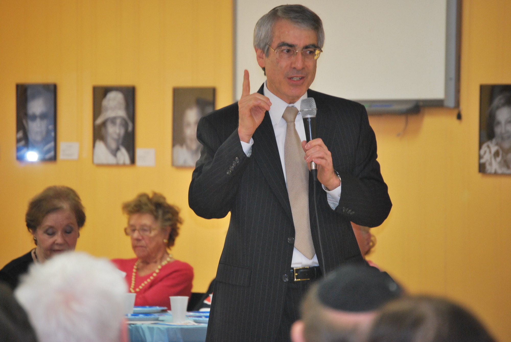 Rabbi Bruce Ginsburg of  Congregation Sons of Israel spoke to the Holocaust survivors at the JCC party.