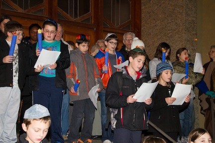 Students from Hebrew school sang holiday songs.