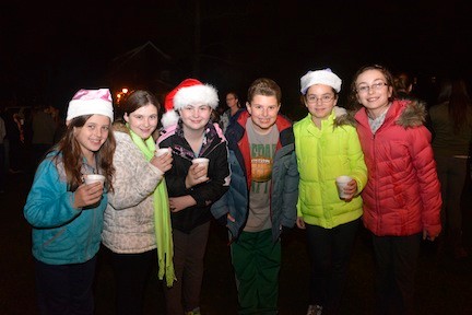 Camille Charvet, left, Jacqueline and Tori Pozzulo, Charlie Casolaro, Jenna Flynn and Josephine O’Brien had some hot cocoa at the tree lighting.
