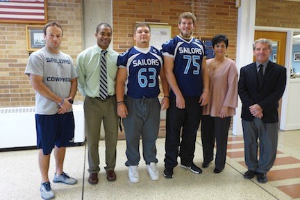Al Martone Nassau County Lineman of the Year, James Kretkowski (center right) with (left to right) Assistant Coach Joseph Supple, Coach Rob Blount, teammate Max Schneider, OHS Principal Gerri DeCarlo and Director of Athletics, Health and PE Jeffrey Risener. James and Max were also selected for the All Long Island First Football Team. James is Oceanside High School’s first winner.