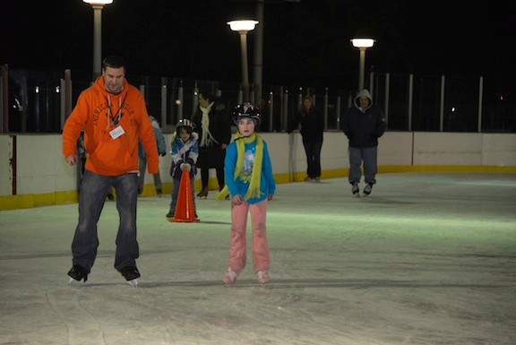 Zoe Minor, 10, escorted Herald editor Andrew Hackmack around the ice for one lap.