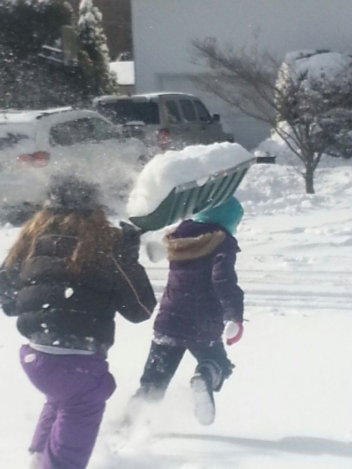 Abigail Pallotta ran for her life as her sister Alyssa tried to douse her with snow