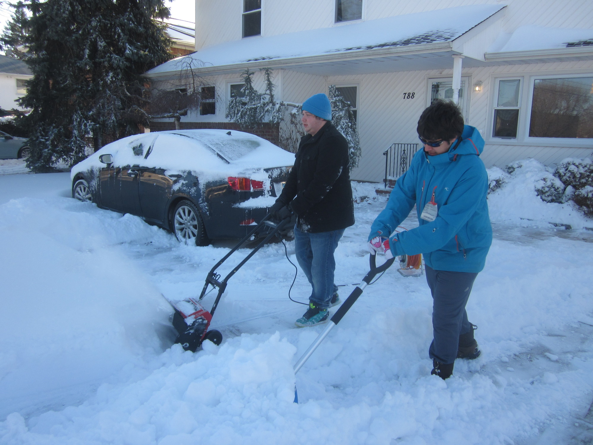Brothers James and Paul Sarris shoveled their Merrick Avenue home.