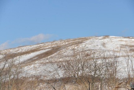 The snow covered the large garbage mound at the Oceanside Landfill on Friday morning.