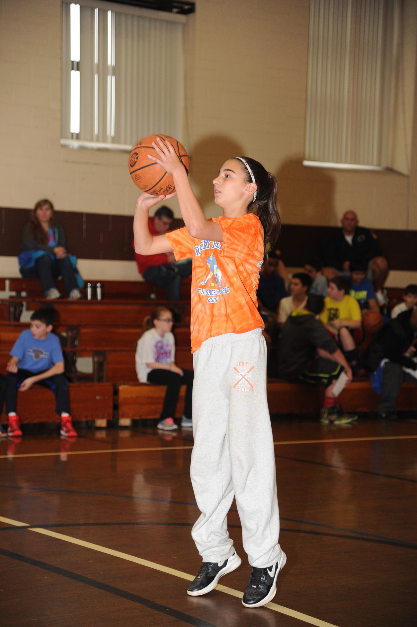 Hannah Arbuse, 13, lined up her shot in the gymnasium of St. Raphael’s parish.