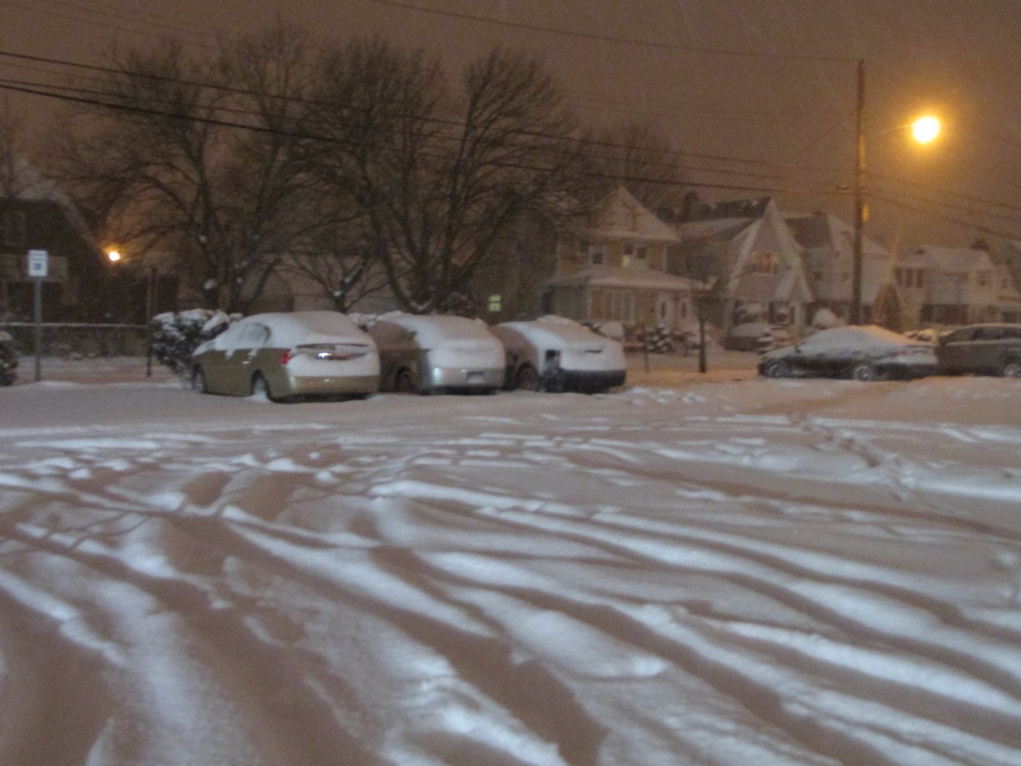 Several cars were snowed in at a municipal lot in Valley Stream.
