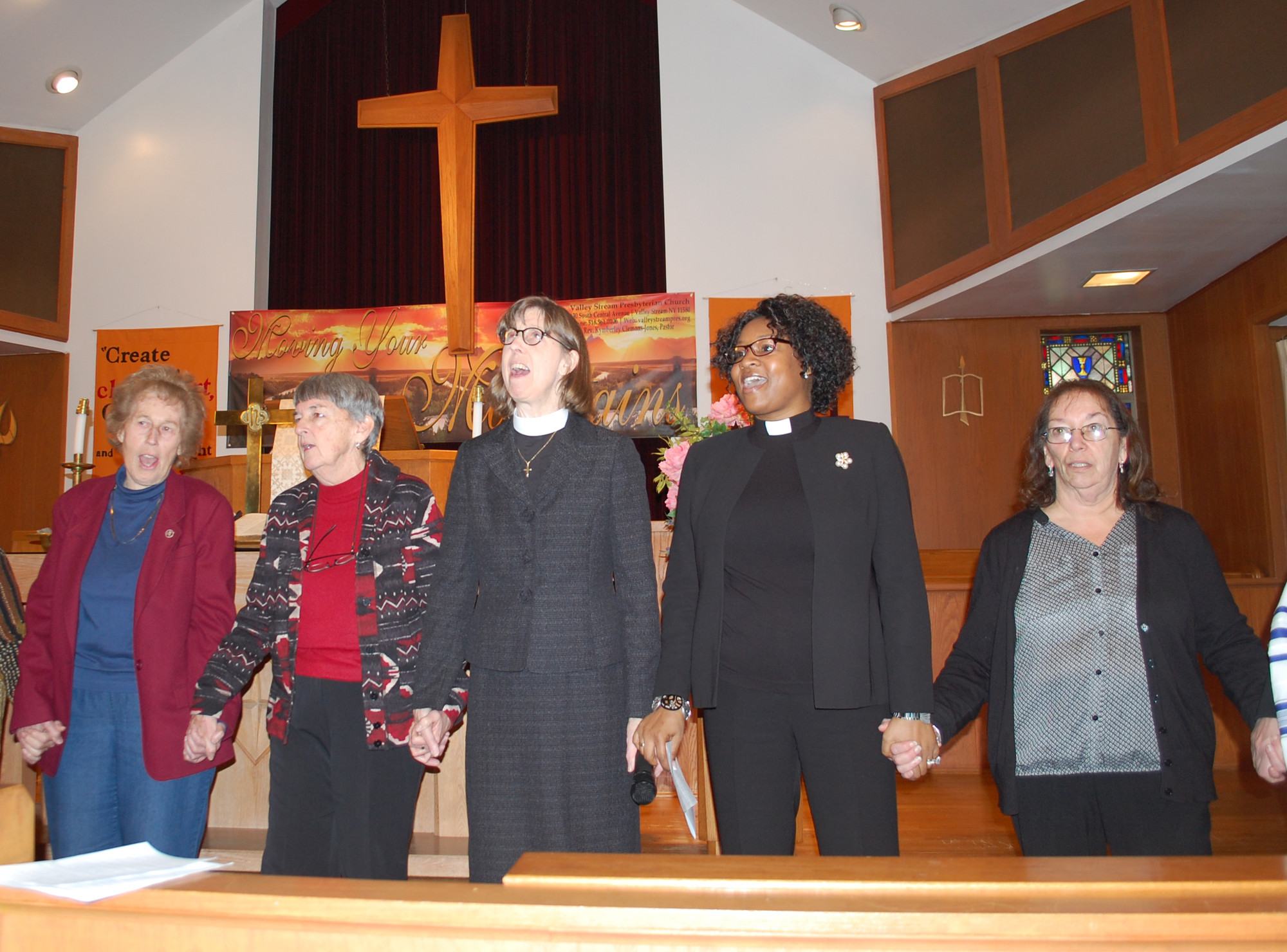 Religious leaders from across the community joined hands to sing “We Shall Overcome” at the annual Dr. Martin Luther King Jr. Day celebration at the Valley Stream Presbyterian Church on Monday. From left were Barbara Myers, Sister Margie Kelly, the Rev. Katherine Brooks, the Rev. Kymberley Clemons-Jones and Marie McNair.