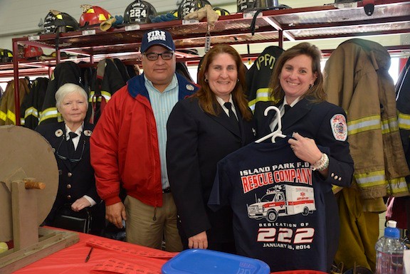 Former Captain Kathryn Silliman, Crew members Alan Greenfield, Susan Pererson and Maryanne Baldino sold T-shirts and raffles as fundraisers for the Rescue Company at the “wet down ceremony” in Island Park.