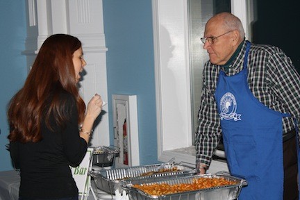 K.C. Putterman, left, was wowed by the food at George Martin's table, manned by Jerry Barnett.