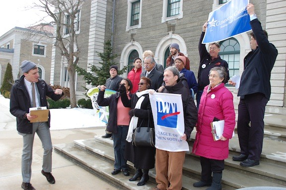 Members of the Nassau United Redistricting Coalition demonstrated on the steps of the Theodore Roosevelt Executive Building on Jan. 27.