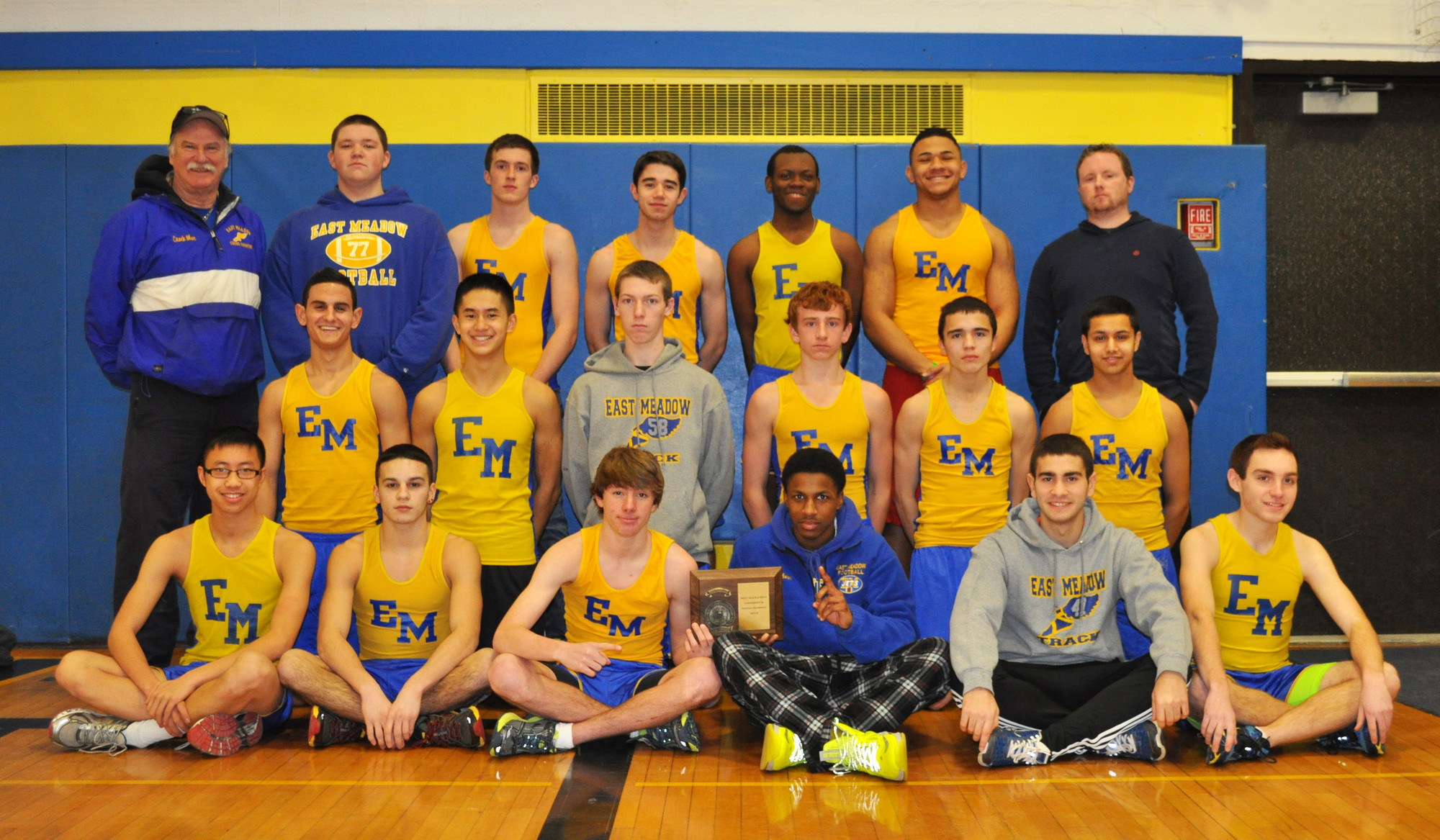 East Meadow High’s conference champion winter track team, at top left, coach Jim McGlynn, Matthew Mascia, Joe Puciloski, Michael Walsh, Jay Robinson, Chika Ewulu, coach Michael Ringhauser, middle row, from left, Prabhnoor Multani, Chris Delgado, Tim Euler, Jake Healy, Peter Vo, Eric Gershoff, and bottom row, from left, Alex Wong, Christian Torres, Mike Grady, Tim Gibson, Rui Cunha and Rob Barracca.    Photo by Tony Belissimo/Herald