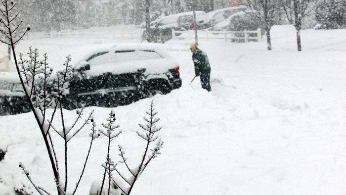 Residents shoveled as much as they could at the height of the morning snowstorm to get their vehicles out.