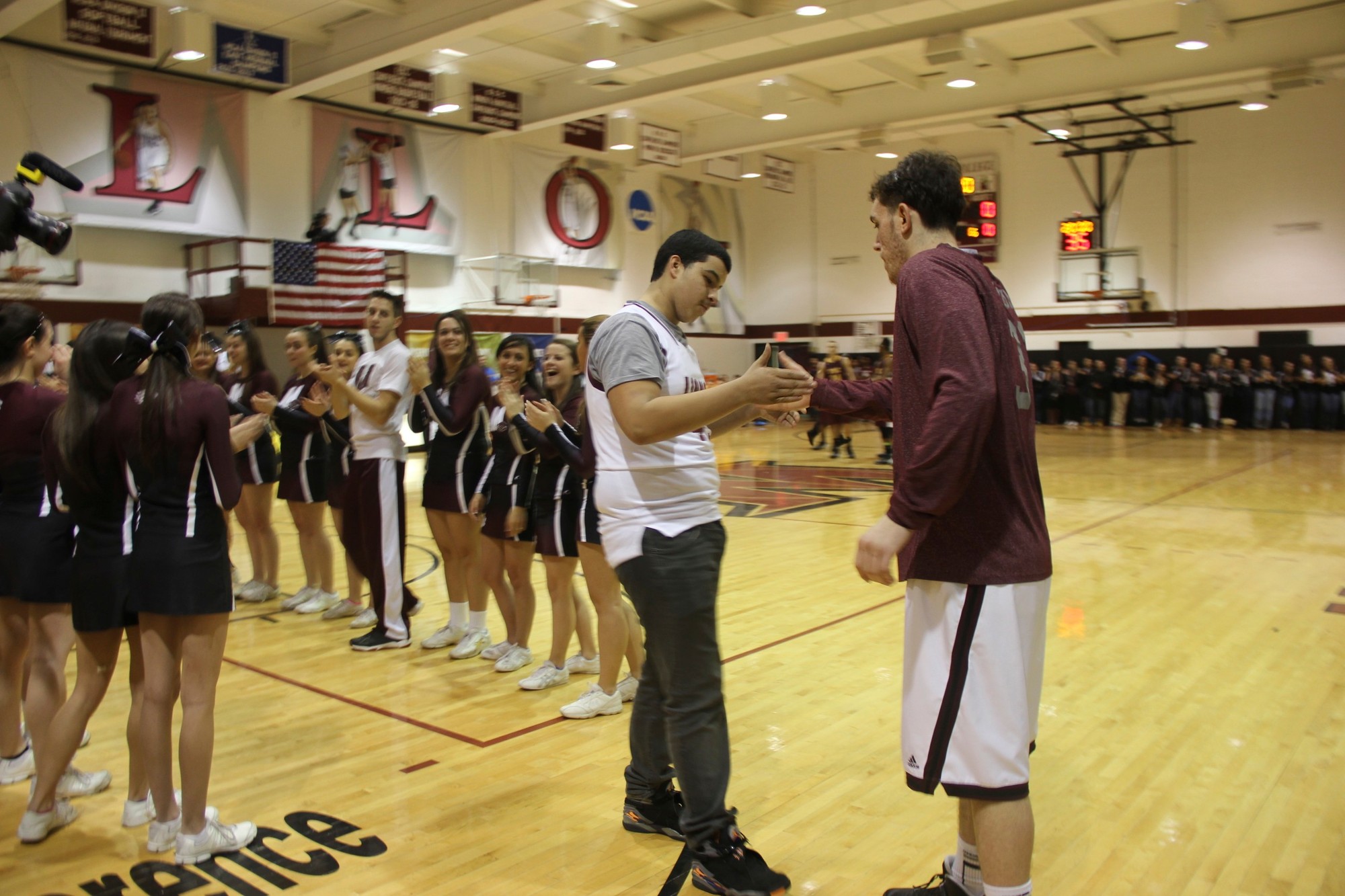 Alexander Perez, 14, left, was welcomed by Molloy basketball player Charlie Marquardt to the team. Molloy made Perez an honorary member of the team in conjunction with the Make-A-Wish Foundation.