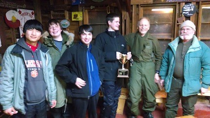 From Left, Keegan Walker, Matthew McDonald, Alex Maher, Owen Clark and leaders Don Wright and Steve Clark showed off their trophy for best sled.