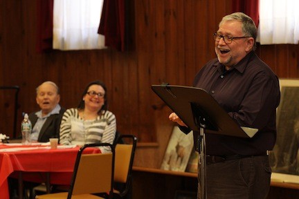 Roy Schmitt gets audience help singing "High Hopes."