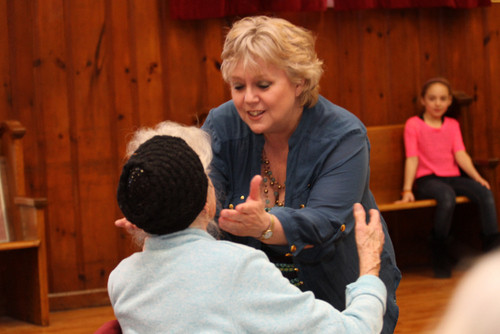 Mary Malloy hugs an audience member during "Cheer Up, Charlie"