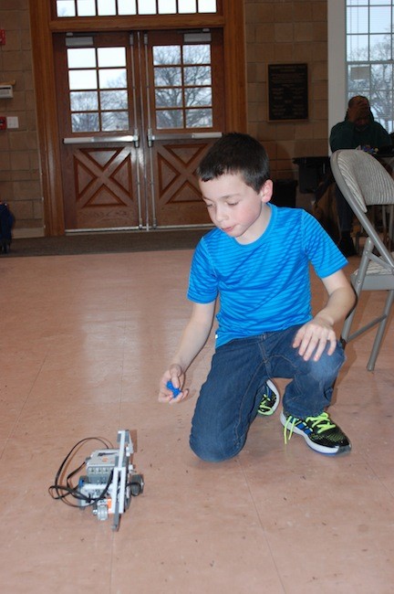 Steven Seltzer watched his completed robot move across the room.