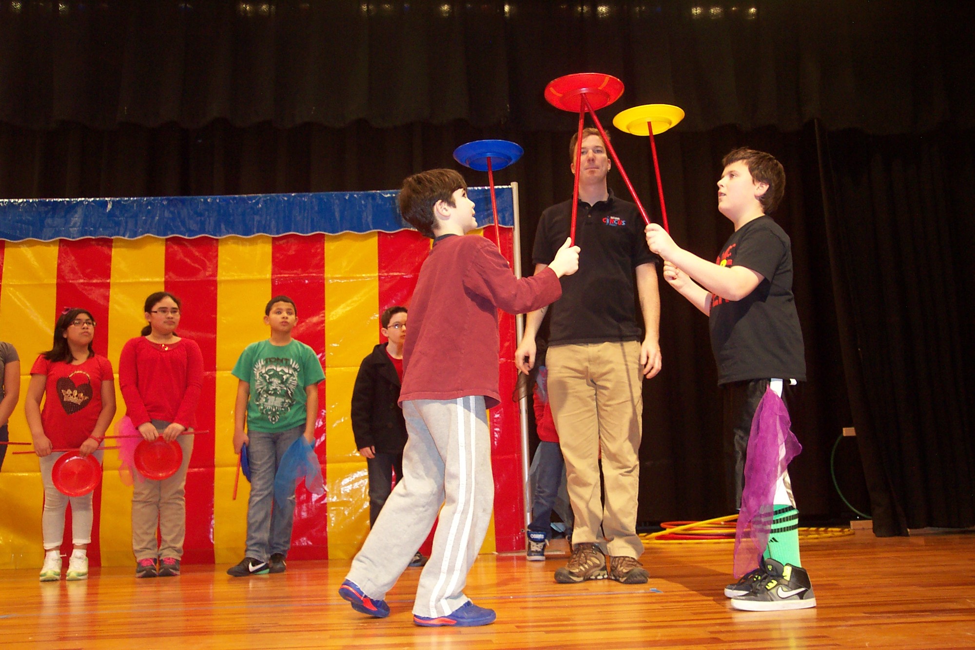 Benjamin Upbin, left, and Jake Vobis spun plates like pros at the Lincoln Orens Middle School in Island Park. LOMS students participated in the National Circus Project in mid-February.