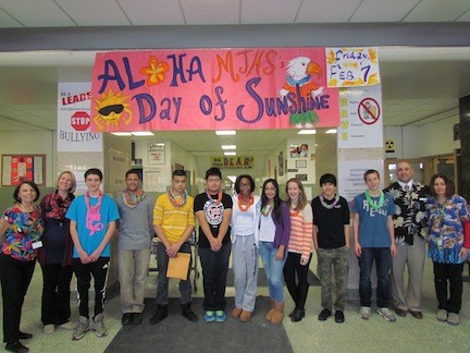 A Day of Sunshine, hosted by the BRAVE Committee earlier this month, was a day to build school spirit at Memorial Junior High School. From left are social worker Maggie McConnell, English teacher Kristine Edgar, students Kyle Bonilla, Otis Adames, Jaime Quiroz, Utsab Rai, Chelsea Davis, Sasha Mendoza, Natalie Zedzian, Brandon Aizcorbe and Kevin Aumuller, Principal Anthony Mignella and school nurse Connie Choinski.