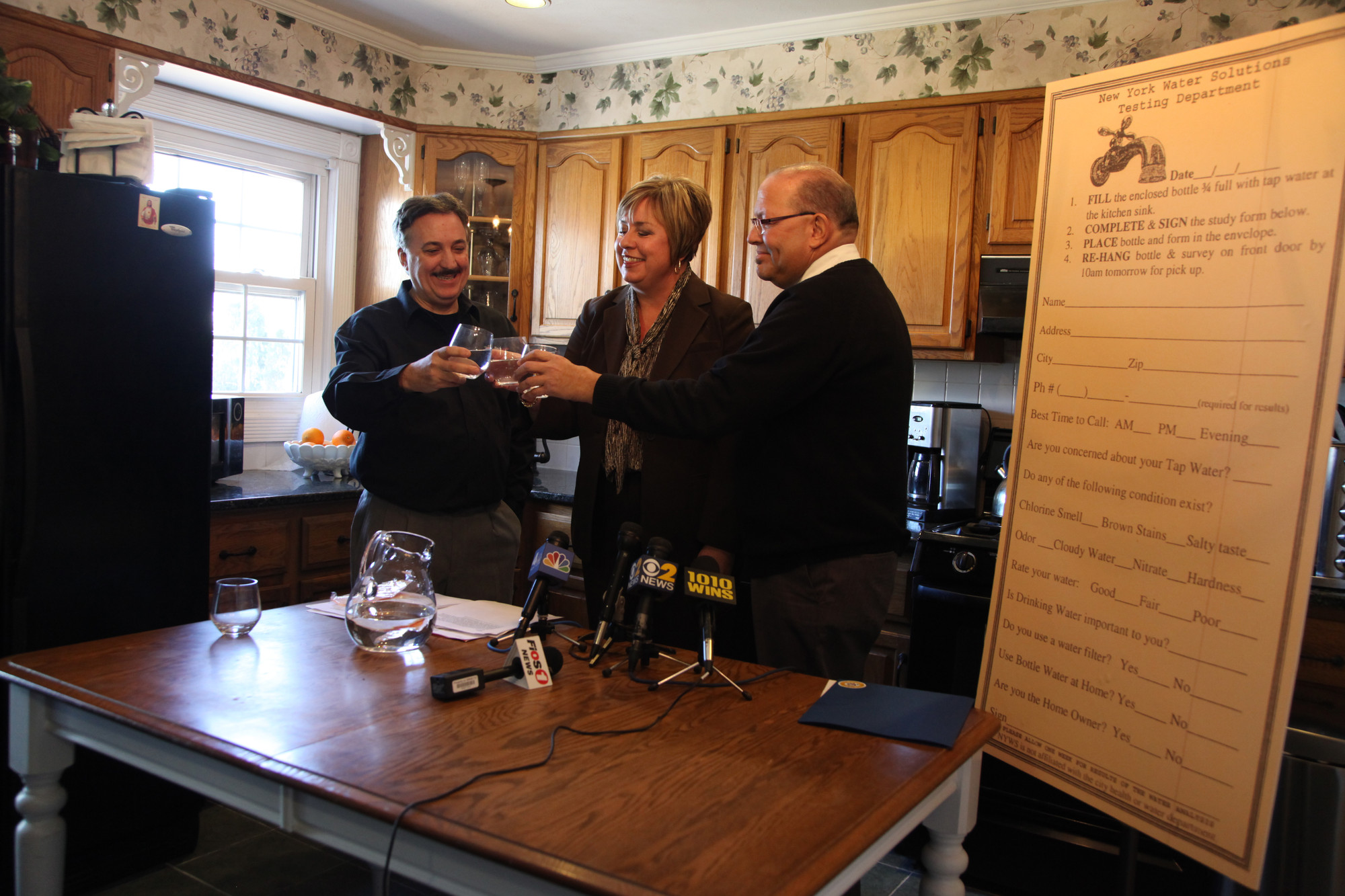 Borrelli’s Italian restaurant owner Frank Borrelli, left, had a water toast inside his home with Town of Hempstead Supervisor Kate Murray and Councilman Gary Hudes to signify that the town’s drinking water is safe.