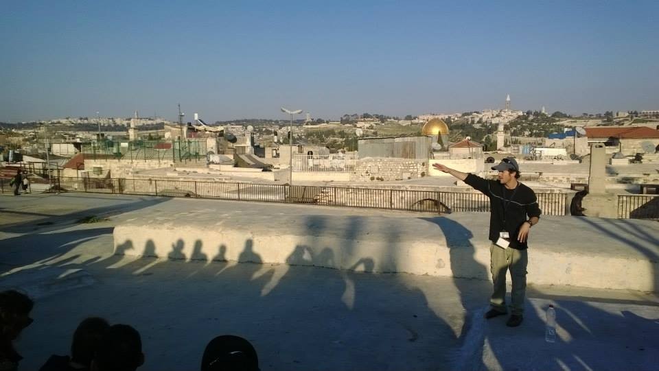 Our Israeli tour guide, Ayal Beer, led us through thousands of years of Israeli history. Here, he educated us on a rooftop in Jerusalem.