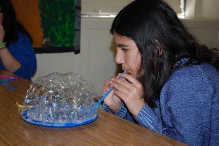 Salwa Zahid learned how to make bubbles in the science enrichment course at the James A. Dever School.