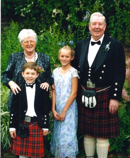 John Wraith with his wife, Philomena, and grandchildren Sean and Kristen.