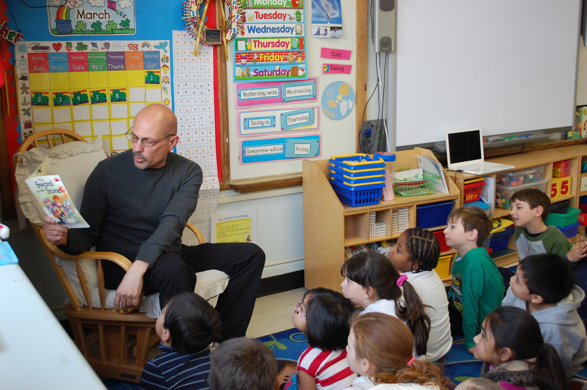 Phys. ed. teacher Joseph Mangini got in on the action, reading to a first-grade class.