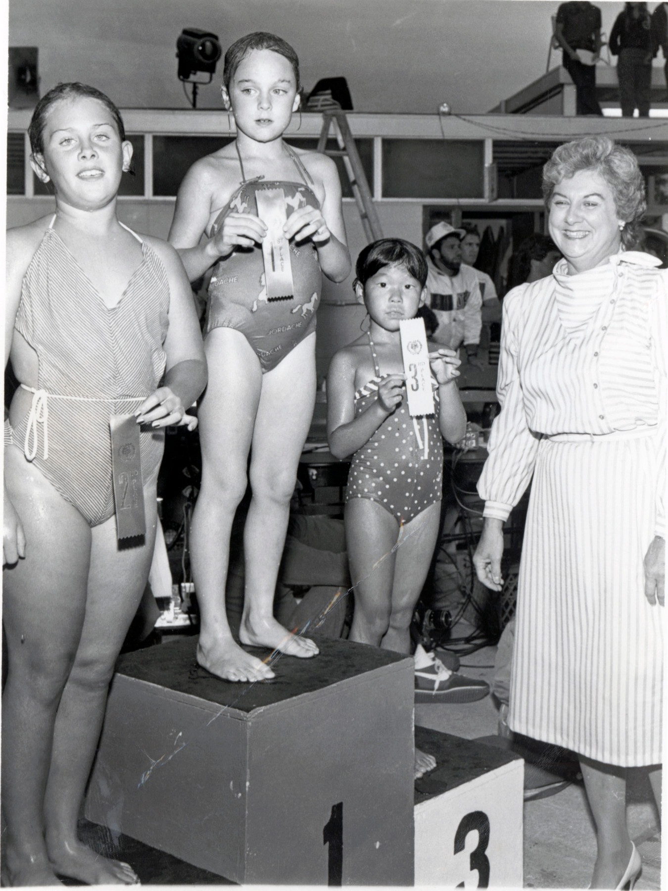 Rosanna Clavin, right, a board member from 1983-91, handed out awards one year to swim team members at the village pool.
