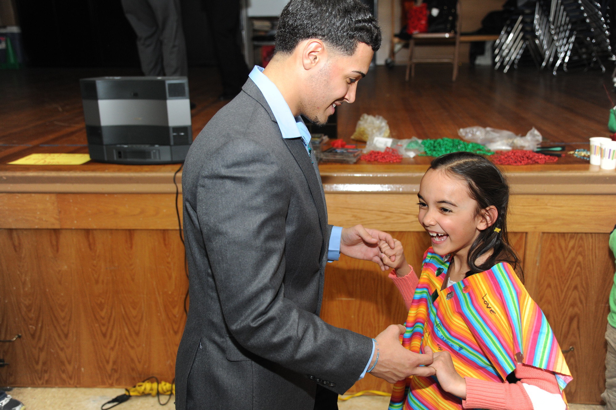 Marcus Ramirez taught Girl Scout Sevi Ozgur, 8, to salsa during his cousin Melina Ramirez’s Latina Cultural Workshop at Meadowbrook Elementary School on March 28.