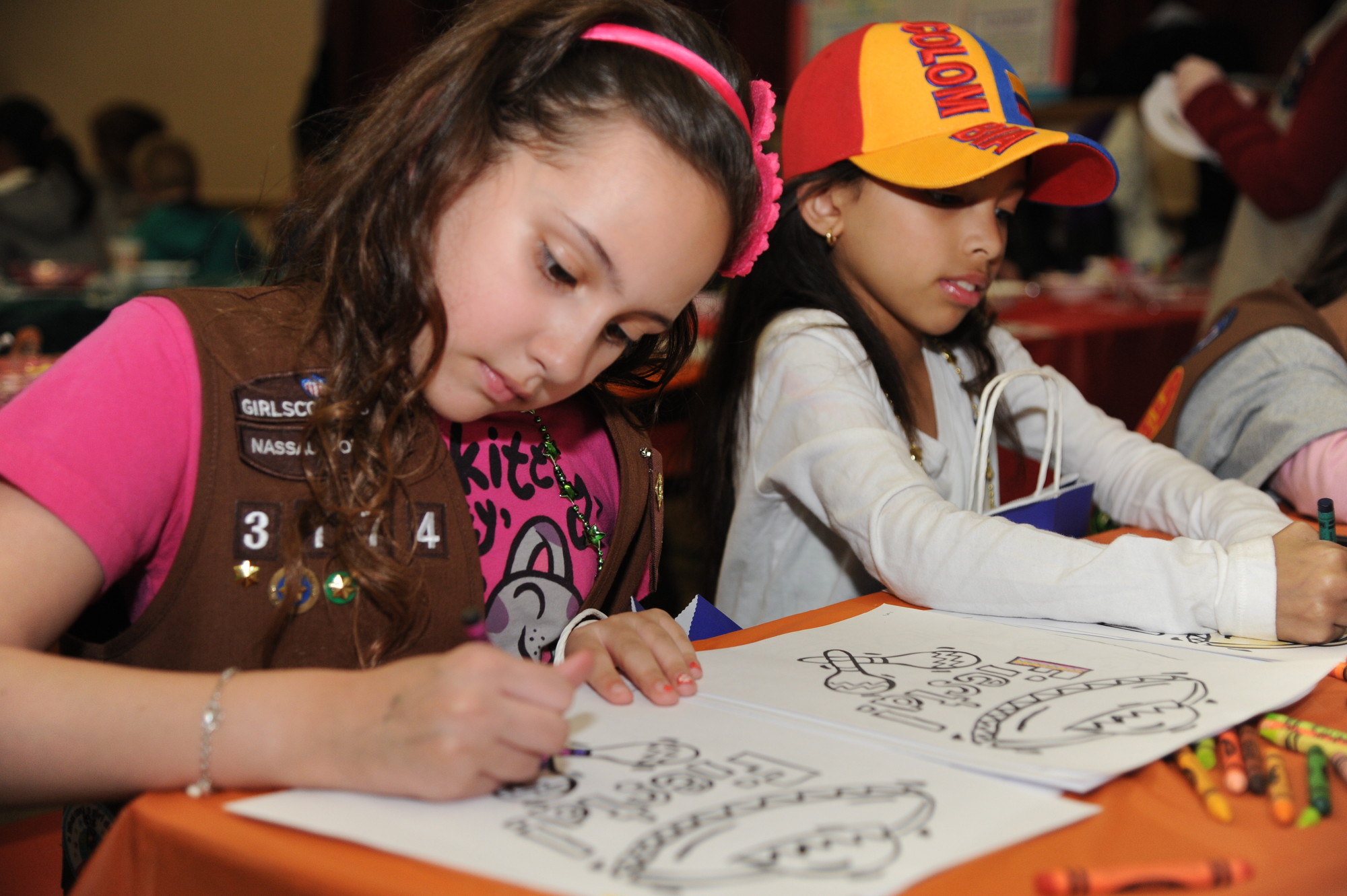 More than a dozen tables offered a variety of activities and topics relating to Latin American culture, including arts and crafts. Above, Alexa Cespedes and Valentina Myers, both 9, were eager participants.