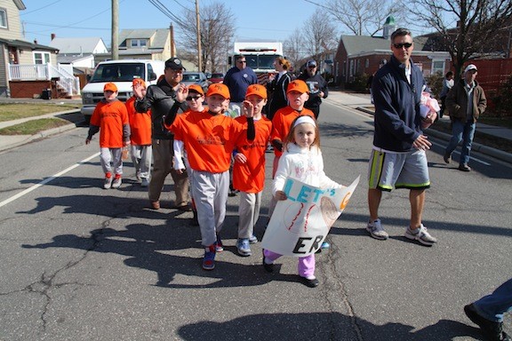 Players, coaches and families marched in the East Rockaway Little League Parade on  April 5.