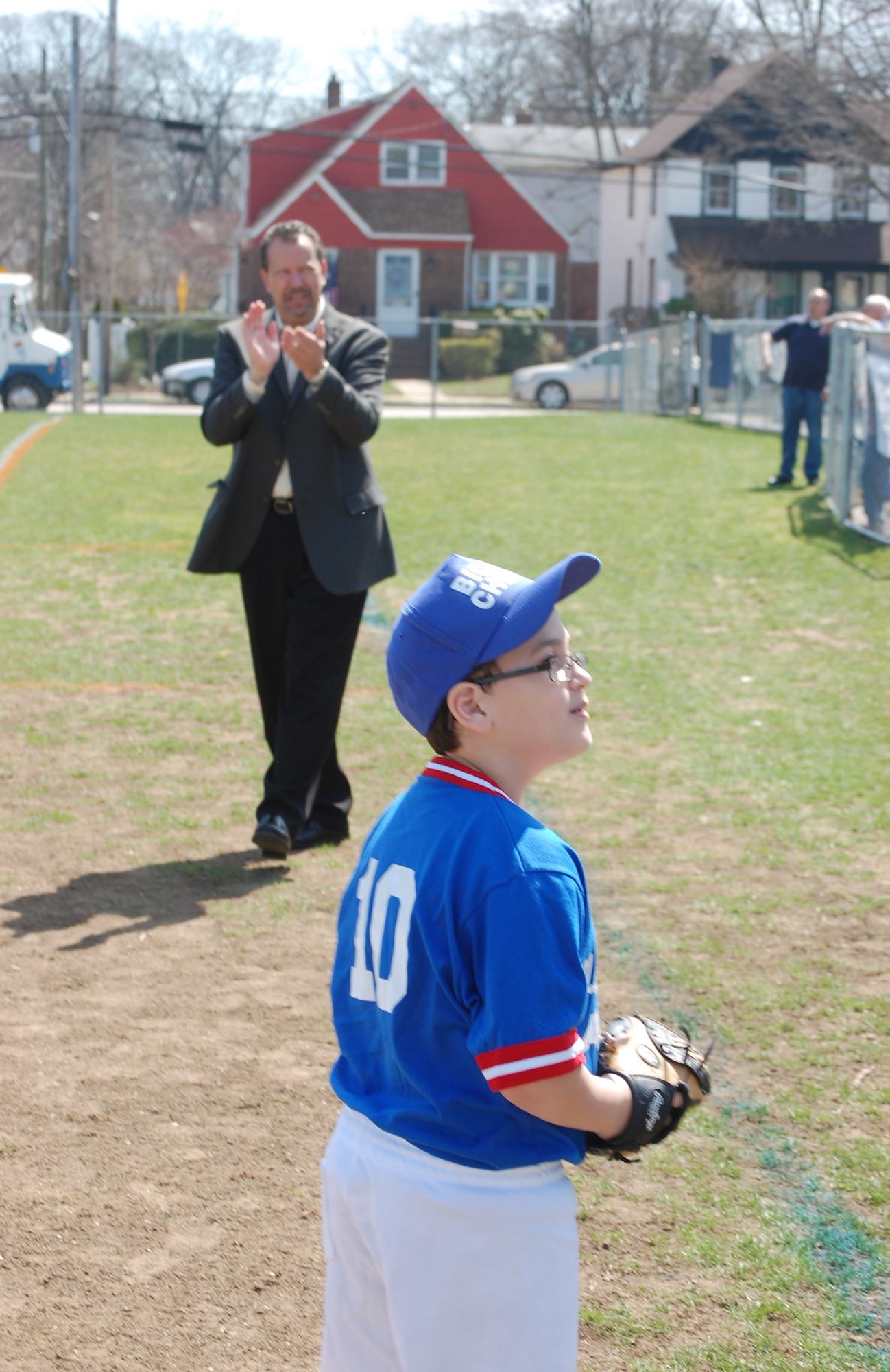 Nicholas Baez, 9, caught the first pitch from Mayor Ed Fare.