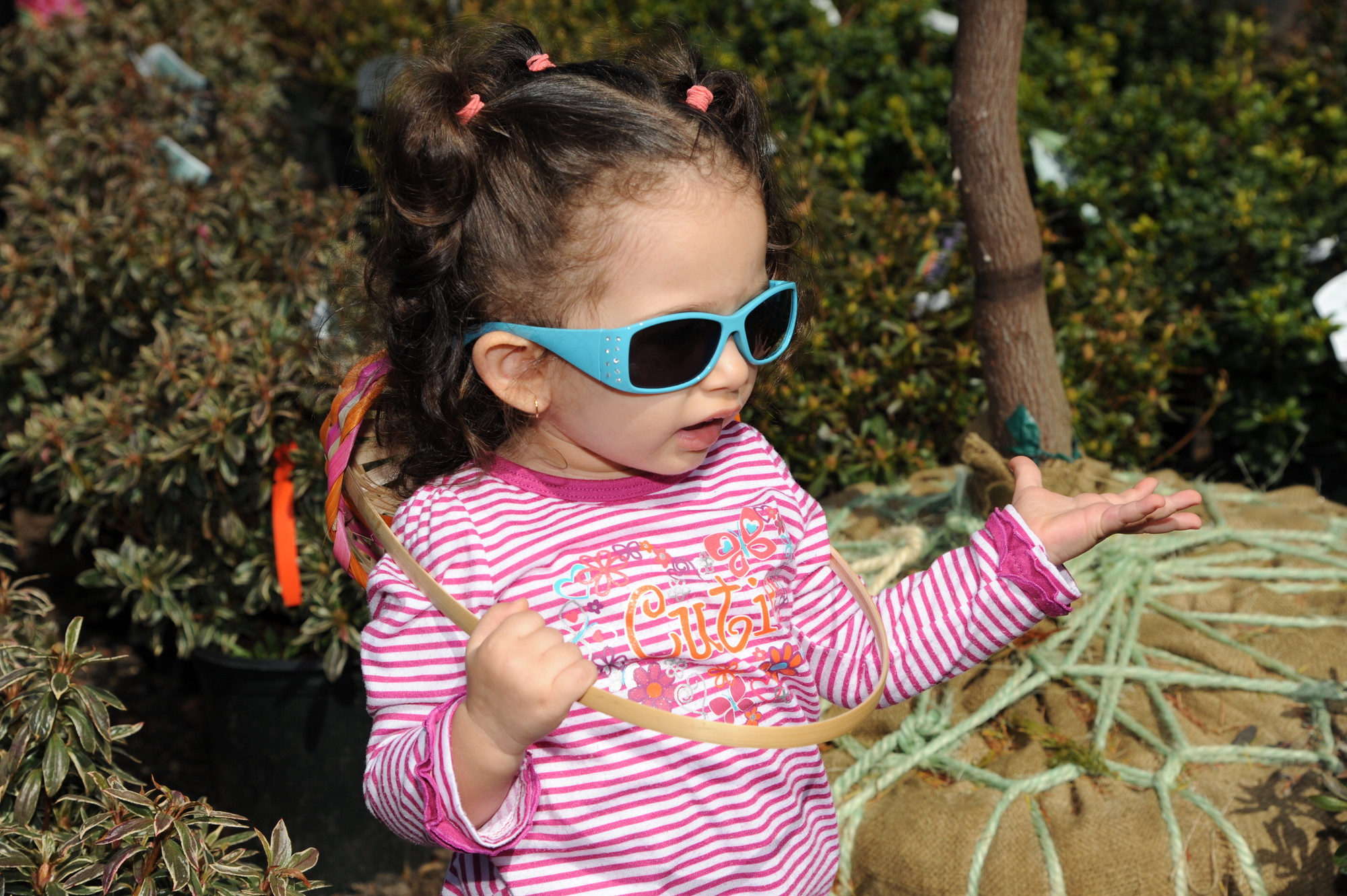 Sophia Patris, 2, hoped her sunglasses would help her locate more Easter eggs.