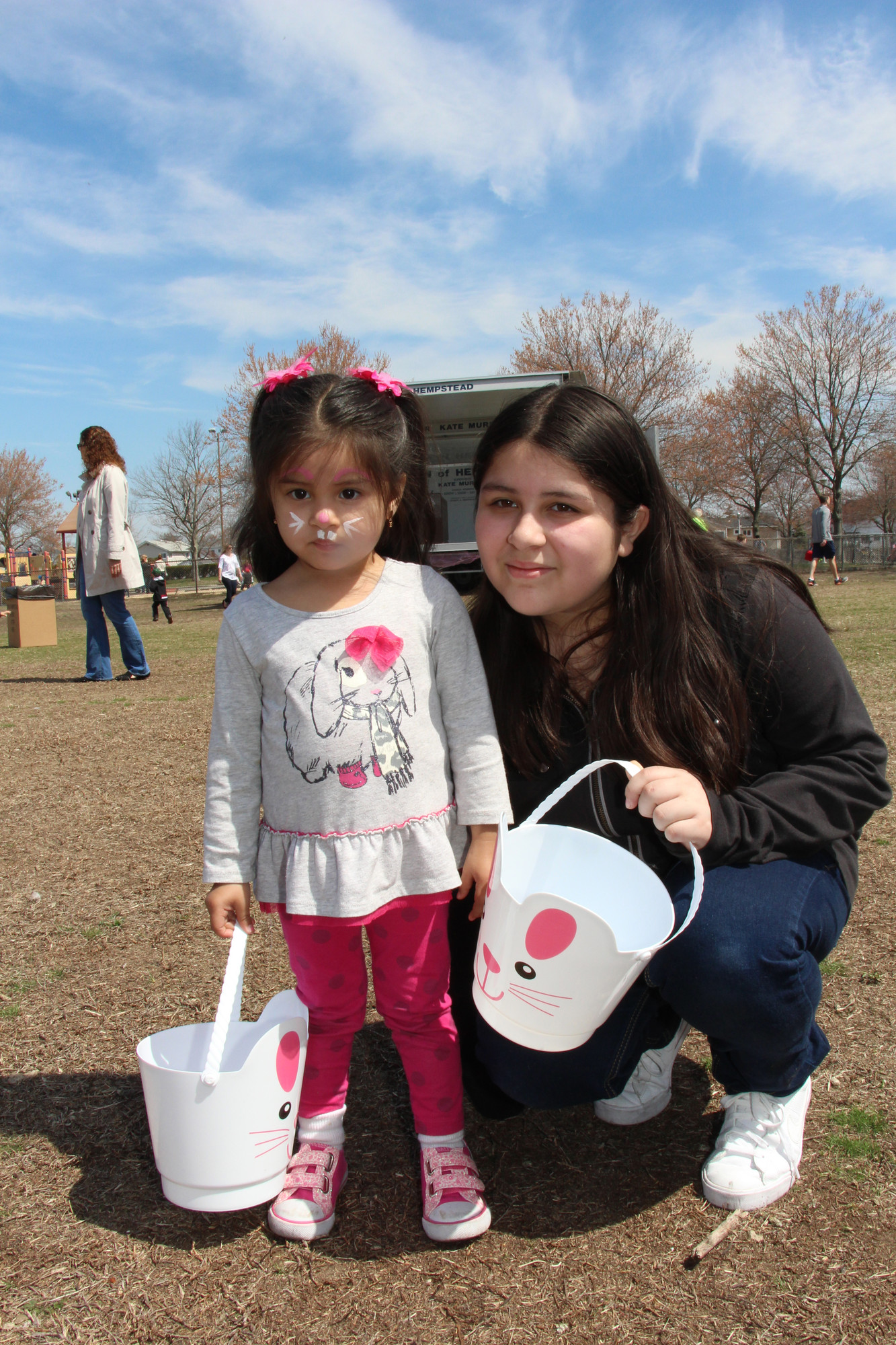 Valarie Nunez, 2, with her aunt Anna Nunez, was ready to look for some eggs.