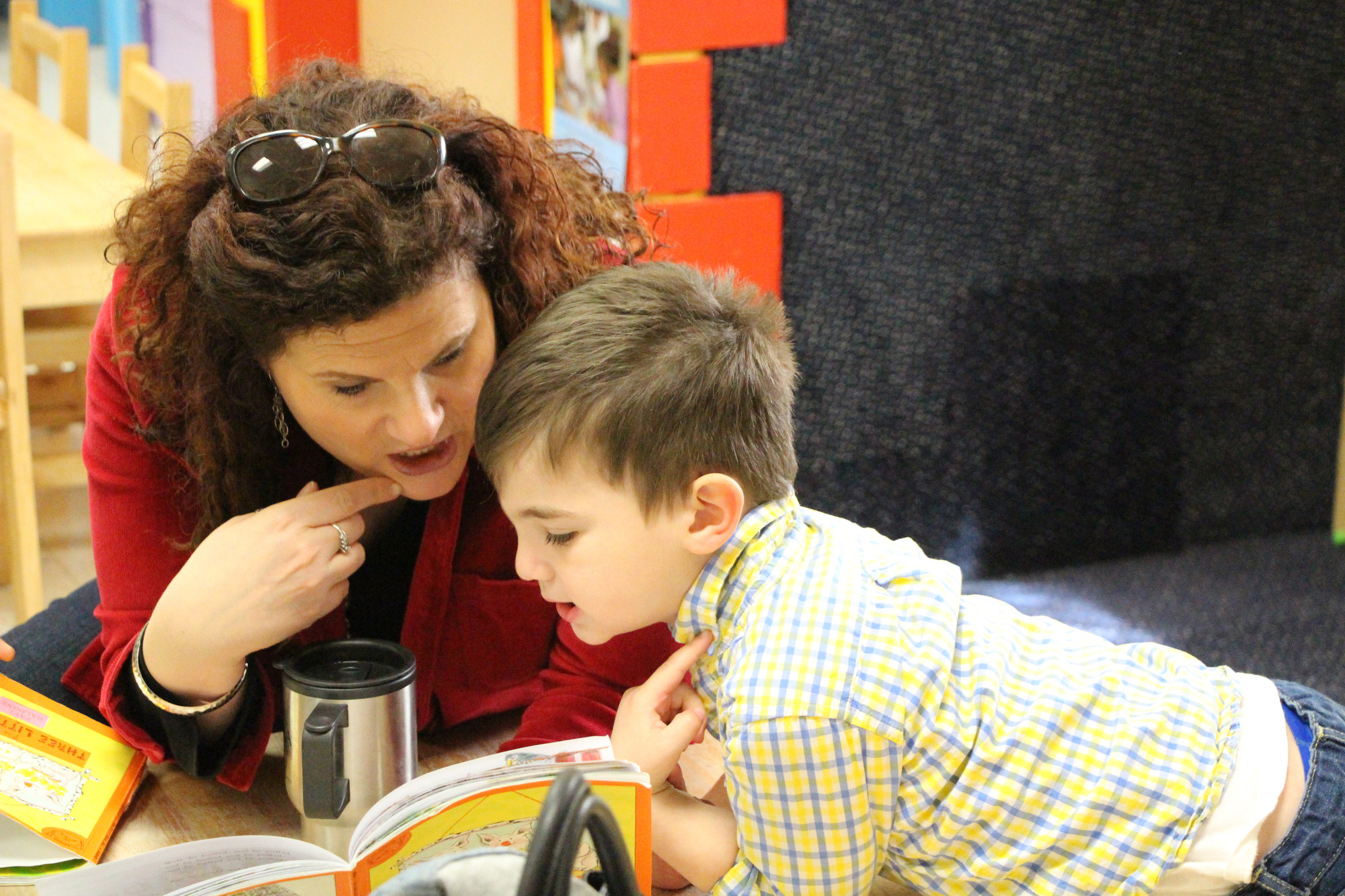 Griffin Reyer, 3, read a story with Adrianne Reyer just before his theater class began at Tutor Time on April 12. He and his classmates performed a song and dance from Disney’s ‘Beauty and the Beast.’
