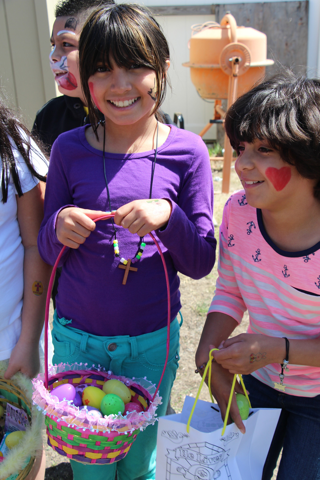 Rudy Malik, 9, above left, with her friend Mimari Velasquez, 9, collected eggs during the South Nassau Christian Church Easter Egg Hunt on April 19.