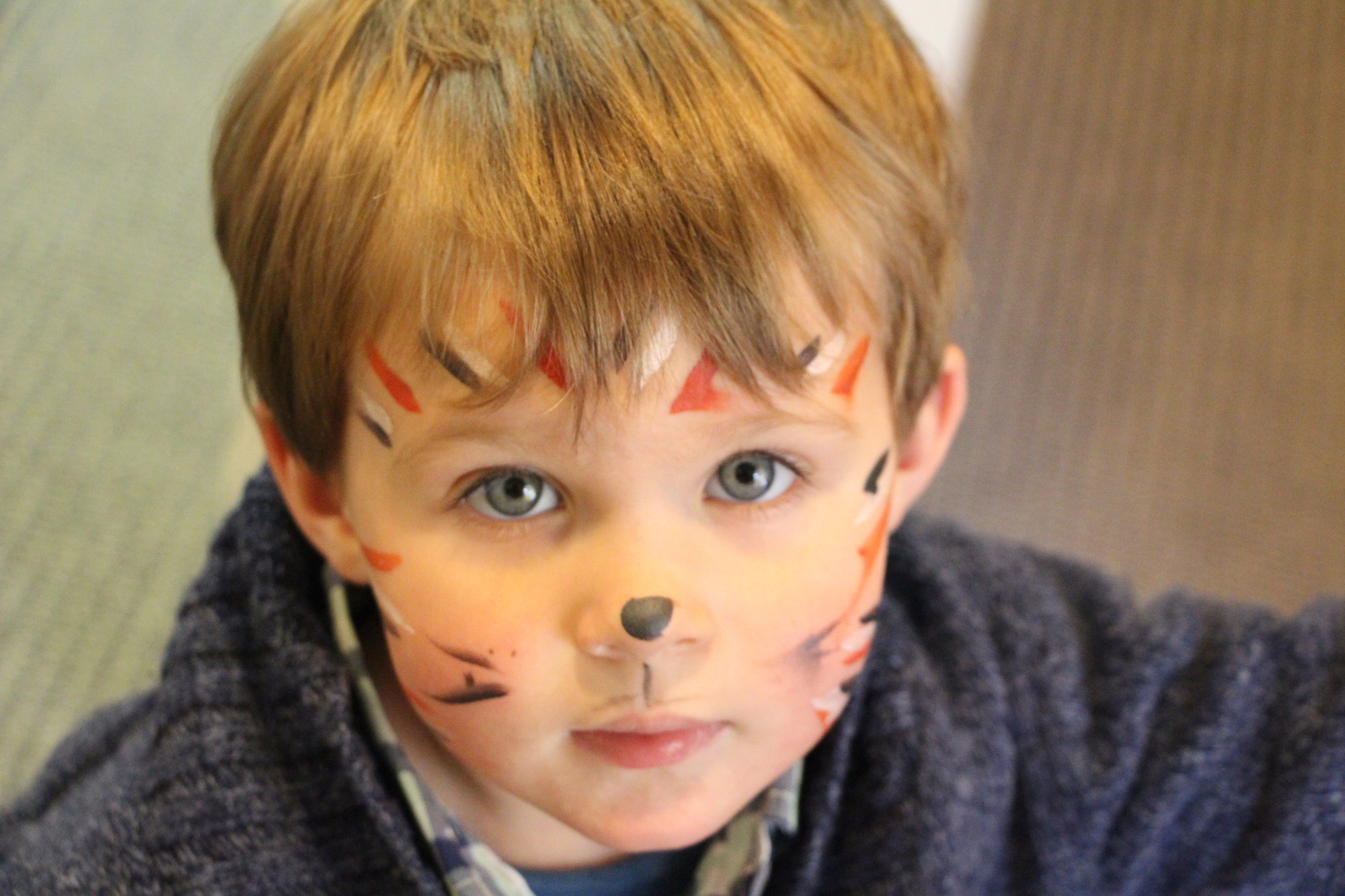 Gavin Drake, 2, had his face painted prior to picking up colorful Easter eggs.
