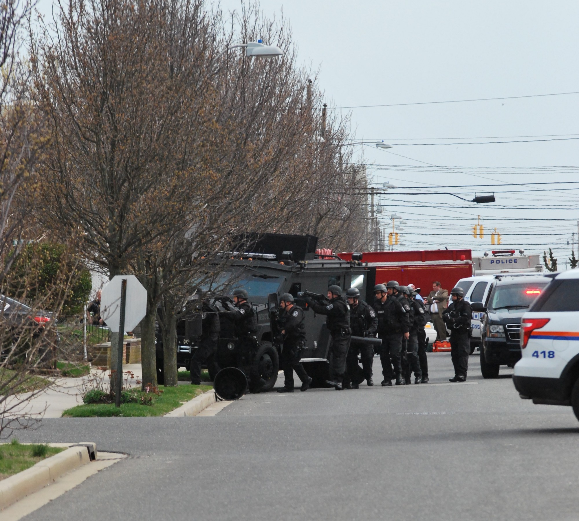 A Nassau County Police Department SWAT team entered a home on Laurelton Boulevard Tuesday after a false 911 call was made to police claiming that a teenager had shot his mother and brother.