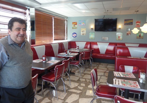 Lynbrook diner owner NIcholas Mavromihalis in his newly-designed meeting room.