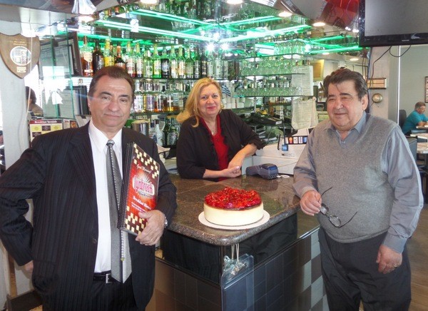 Diner managers Steve Tsiolis and Adrianna Potaris with owner Nick Mavromihalis - and a delcious stawberry cheesecake.