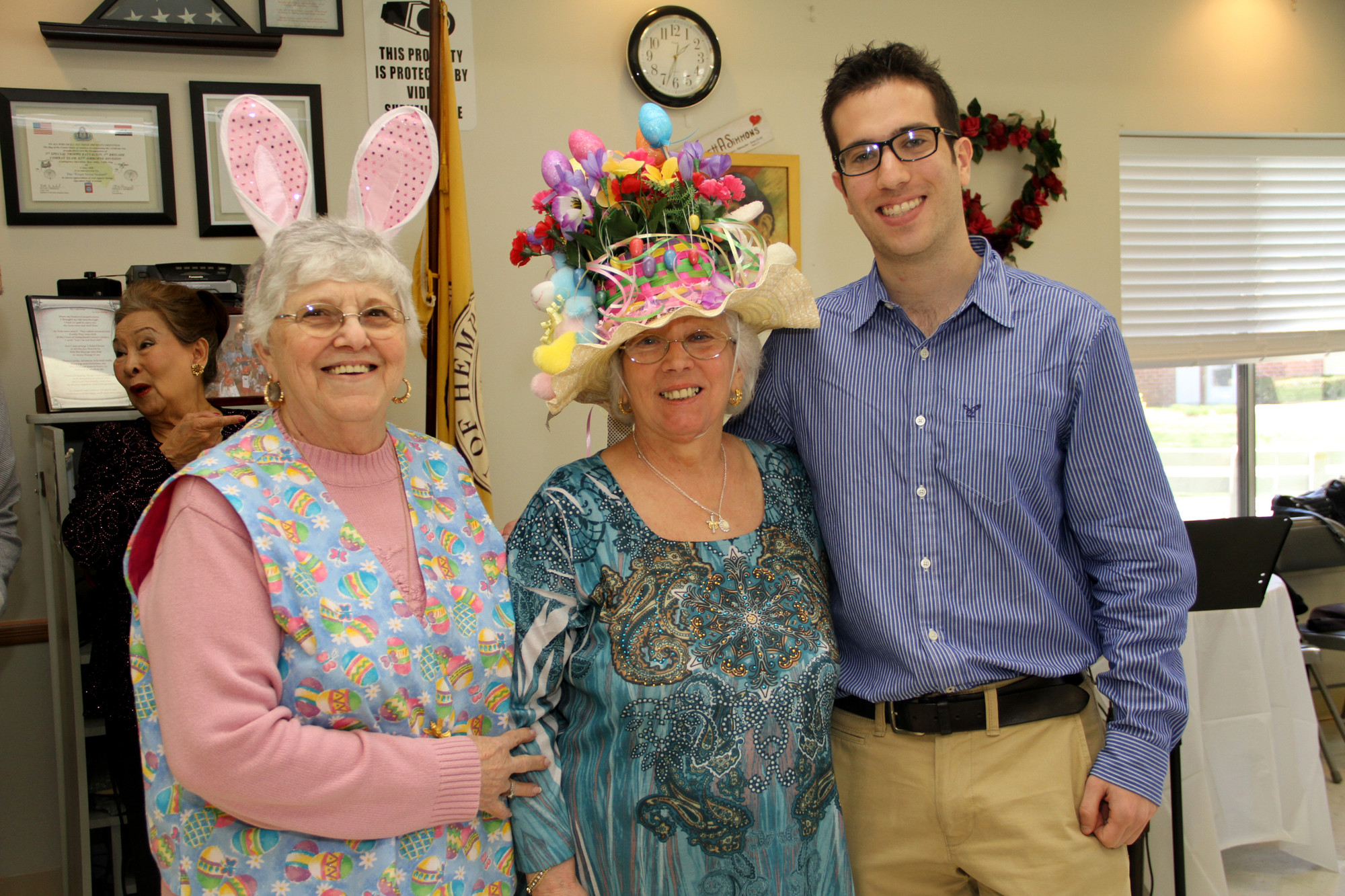 President Phyllis Caggiano, left, with bonnet competition winner Maria Scifo and East Meadow Herald editor David Weingrad, who served as judge.