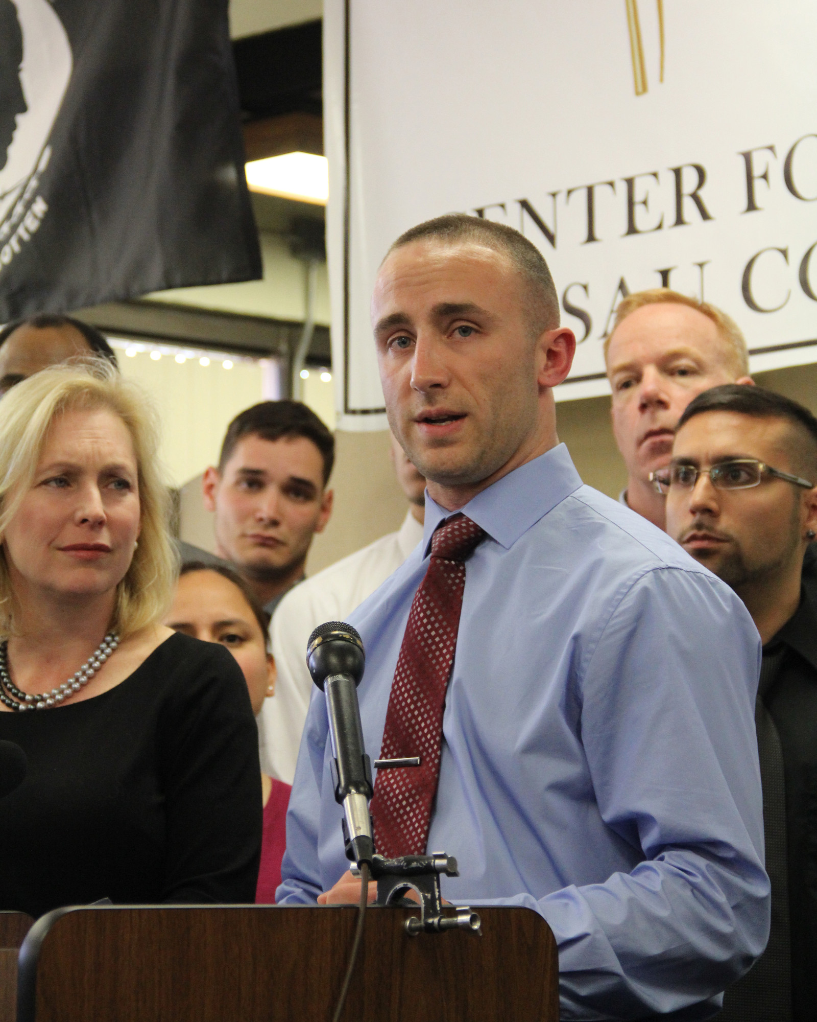 Iraq War veteran Kristofer Goldsmith, 28, detailed his discharge experience at a news conference on April 16, as Sen. Kirsten Gillibrand, left, listened.