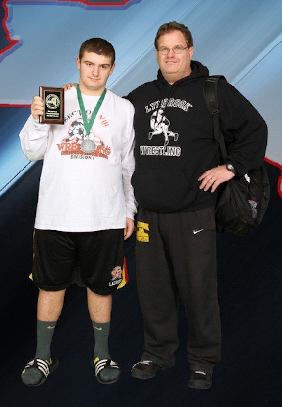 Matthew Renz, left, pictured with his father, Rich, earned All-American wrestling honors at the Junior High level.