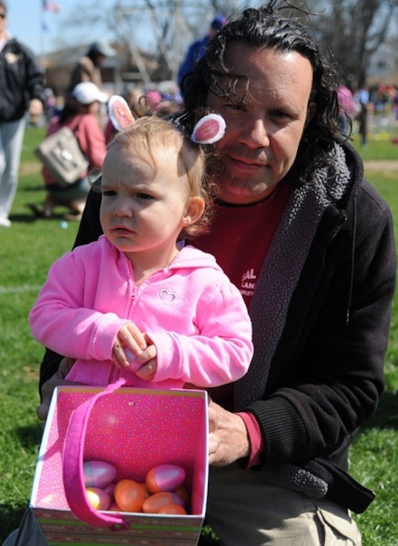 Lola Artusa, 2, and Sal took a break after the egg hunt in Greis Park.
