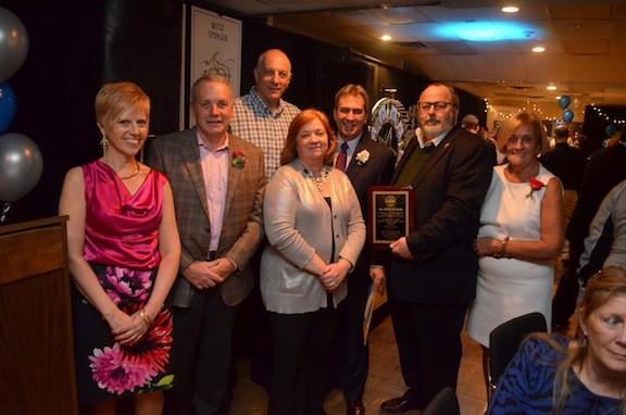Sandel Center Director Chris O’Leary, left, Trustee Emilio Grillo, Trustee Ed Oppenheimer, Deputy Mayor Nancy Howard, Mayor X. Francis Murray, second from right, and FOSSI President Pat Hueber all congratulated Molloy College President and the evening’s honoree Dr. Drew Bogner, third from right.